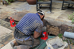 image of worker leveling a slab foundation