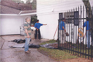 image showing workers around house